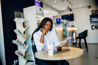 A businesswoman working on a laptop at a desk