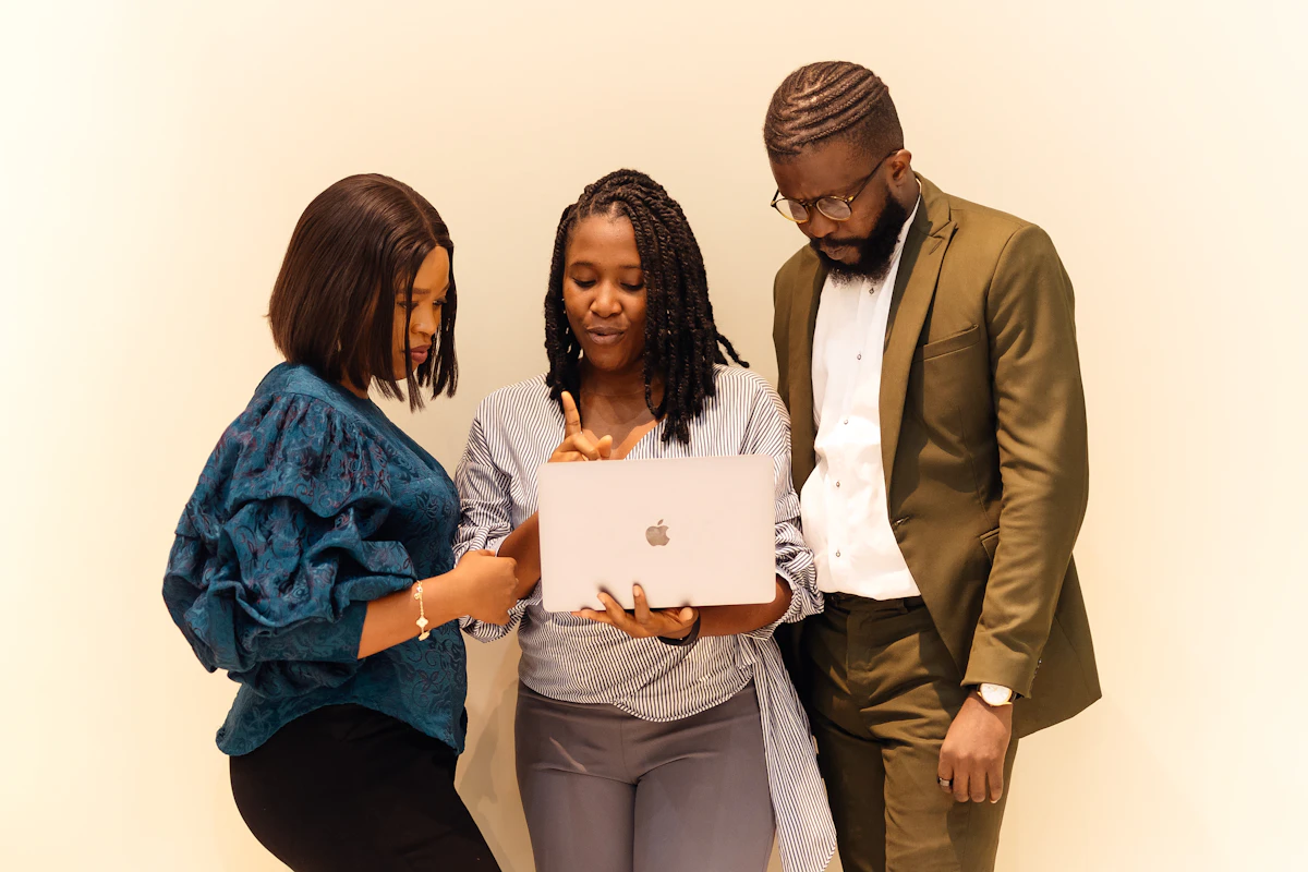 Black Kenyan entrepreneur studying AI technology trends in modern office