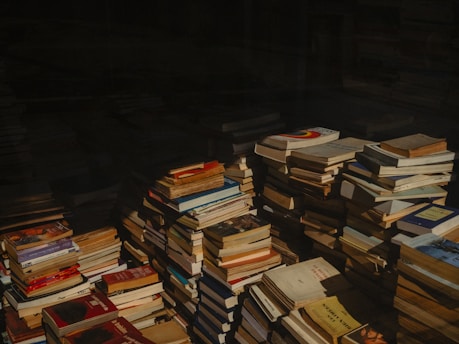 A pile of books sitting on top of a table