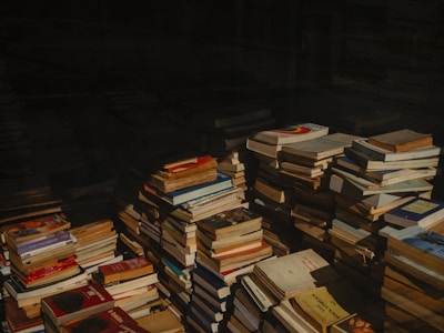 A pile of books sitting on top of a table