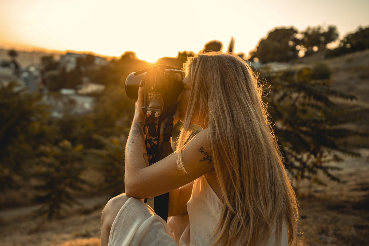Women enjoying a golden hour view on a hilltop