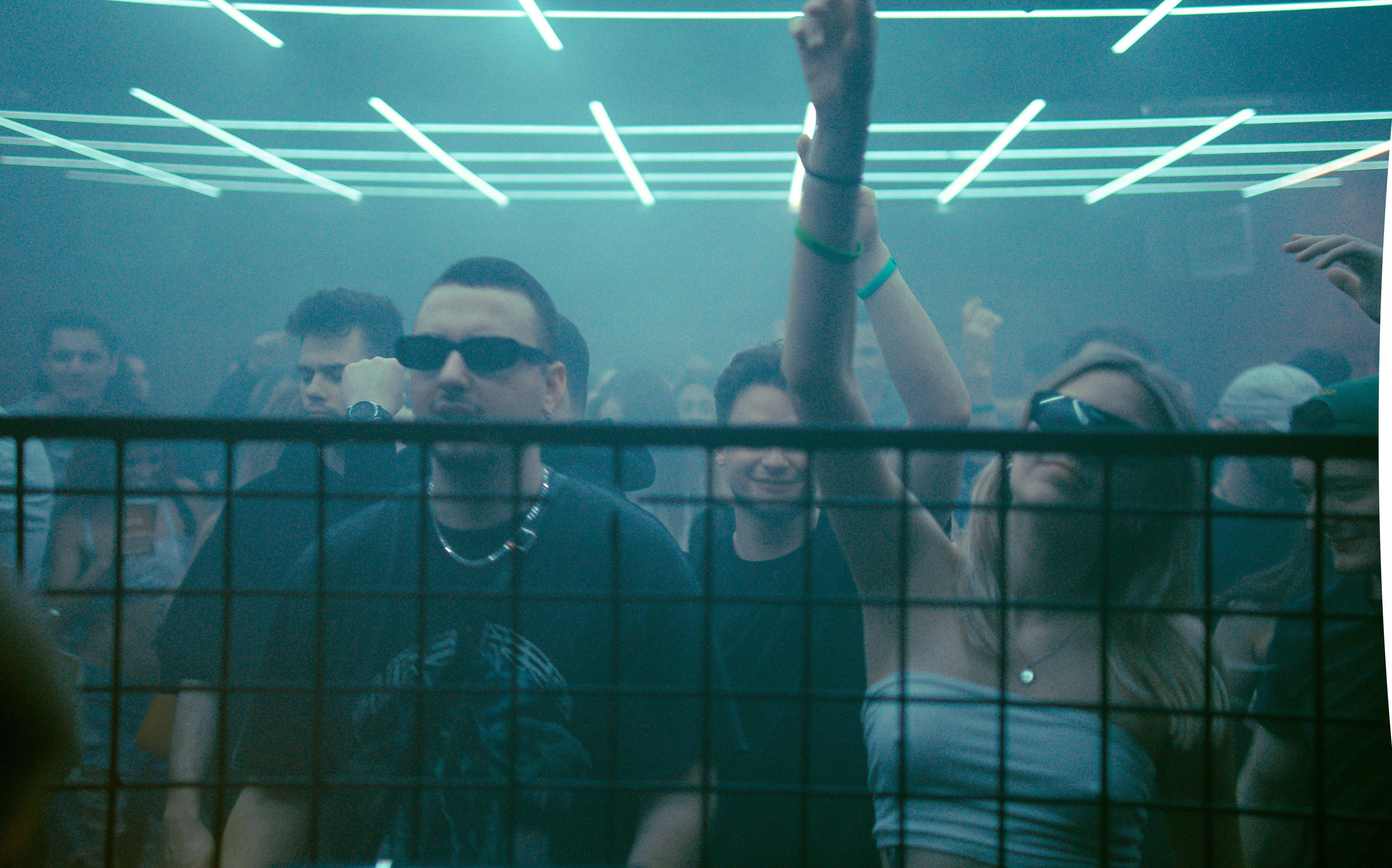 A group of people standing in front of a crowd