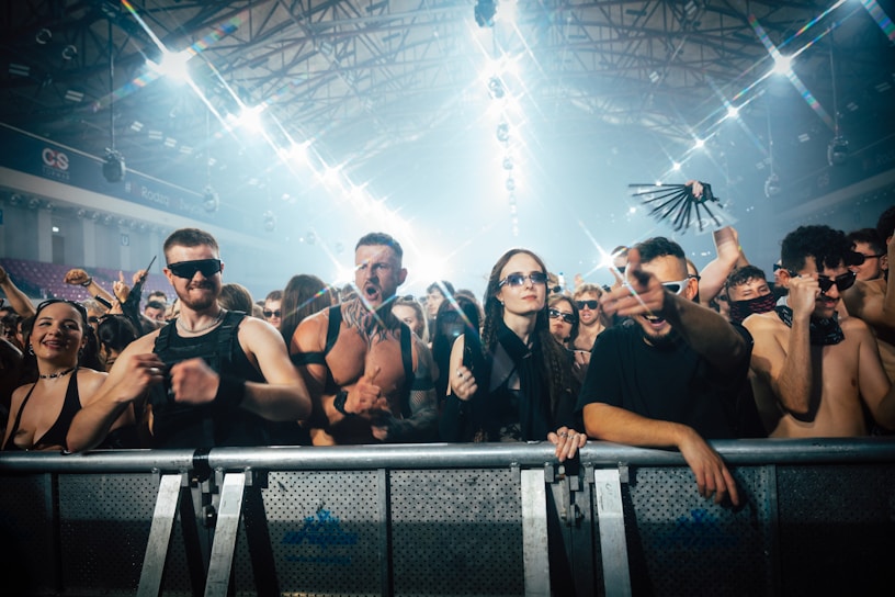 A group of people standing in front of a crowd