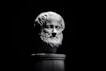 A black and white photo of a bust of a man