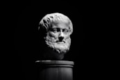 A black and white photo of a bust of a man