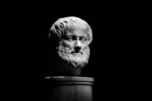 A black and white photo of a bust of a man