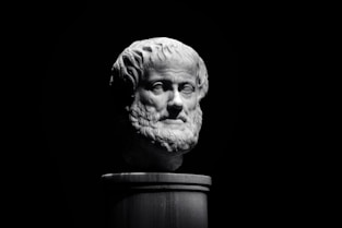 A black and white photo of a bust of a man