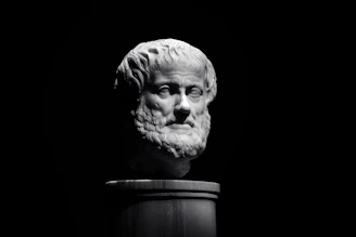 A black and white photo of a bust of a man