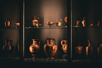 A shelf filled with lots of vases on top of shelves