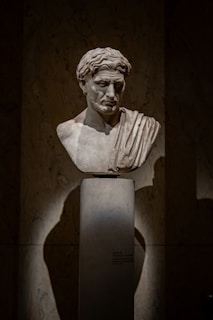 A bust of a man in a dark room