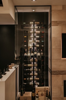 A room with a wine rack in the middle of it