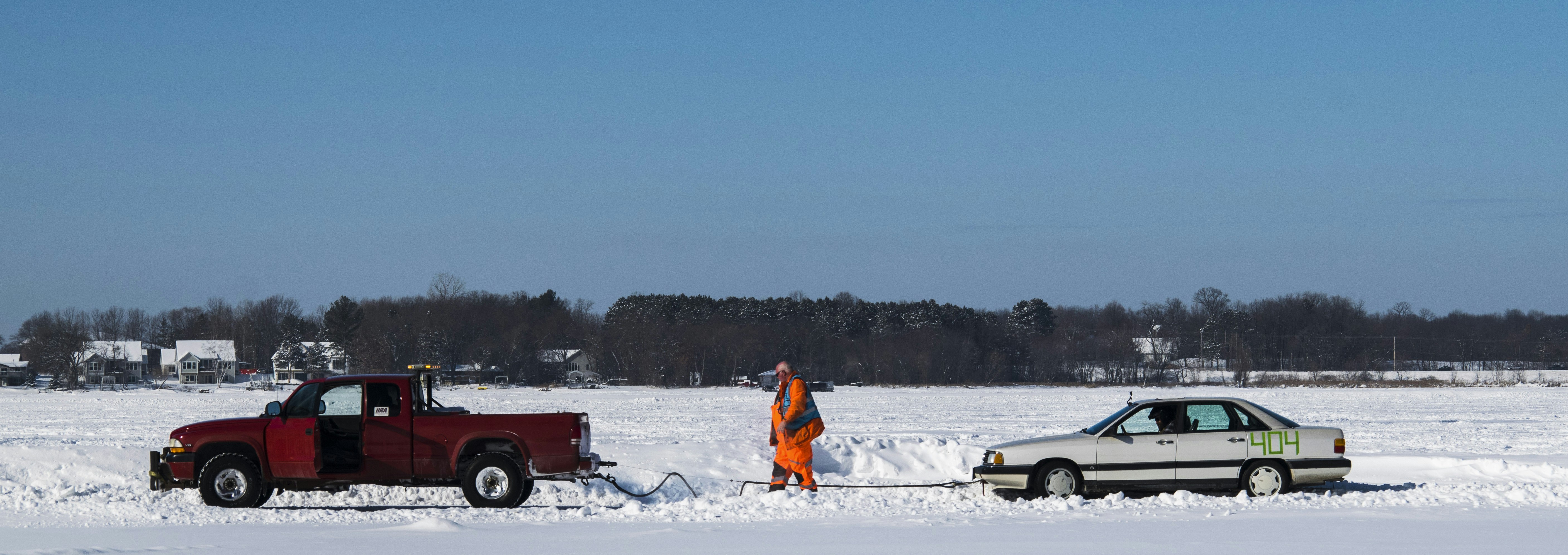 A couple of cars that are in the snow