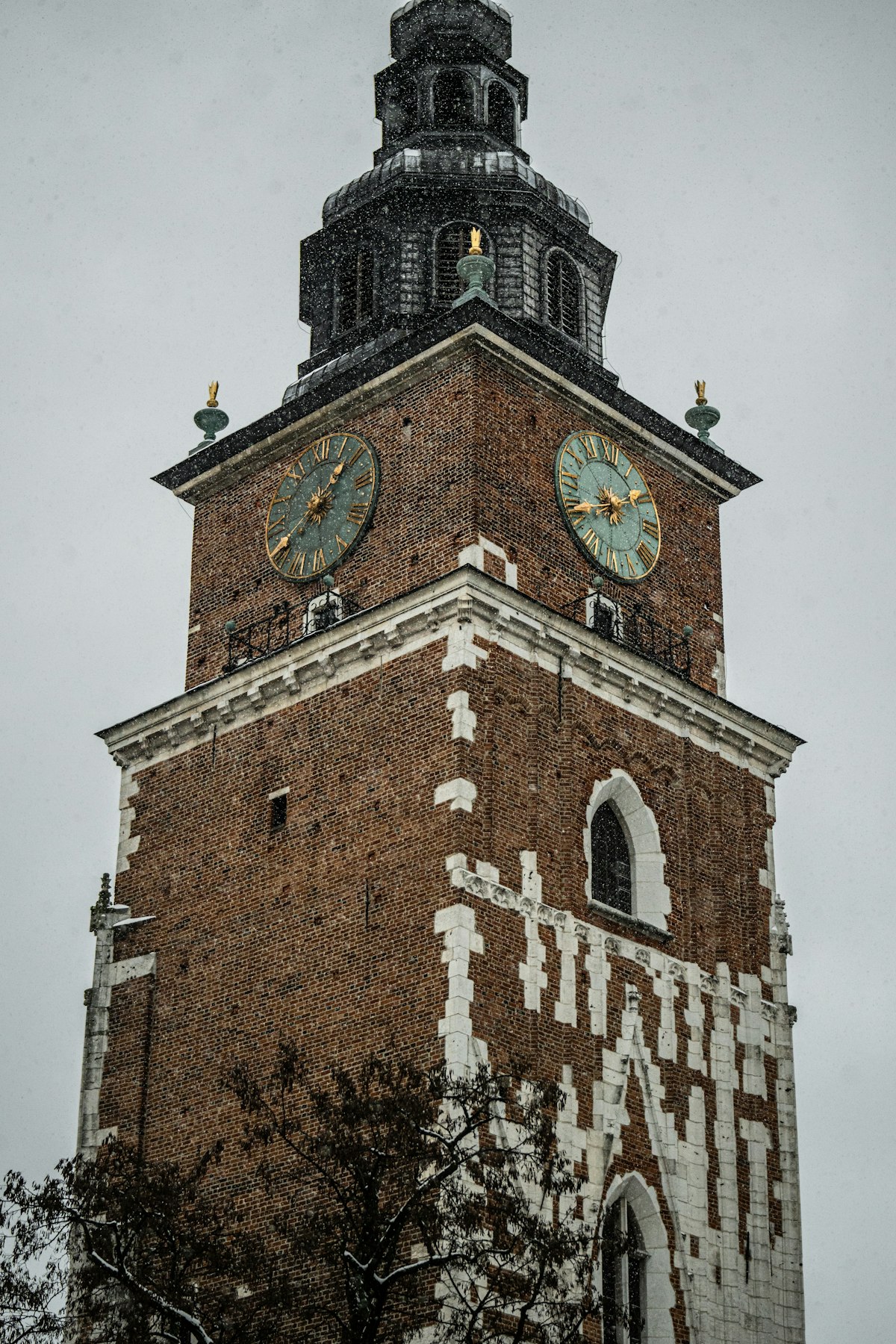Kraków February — Town Hall Tower in Rynek Główny under winter skies