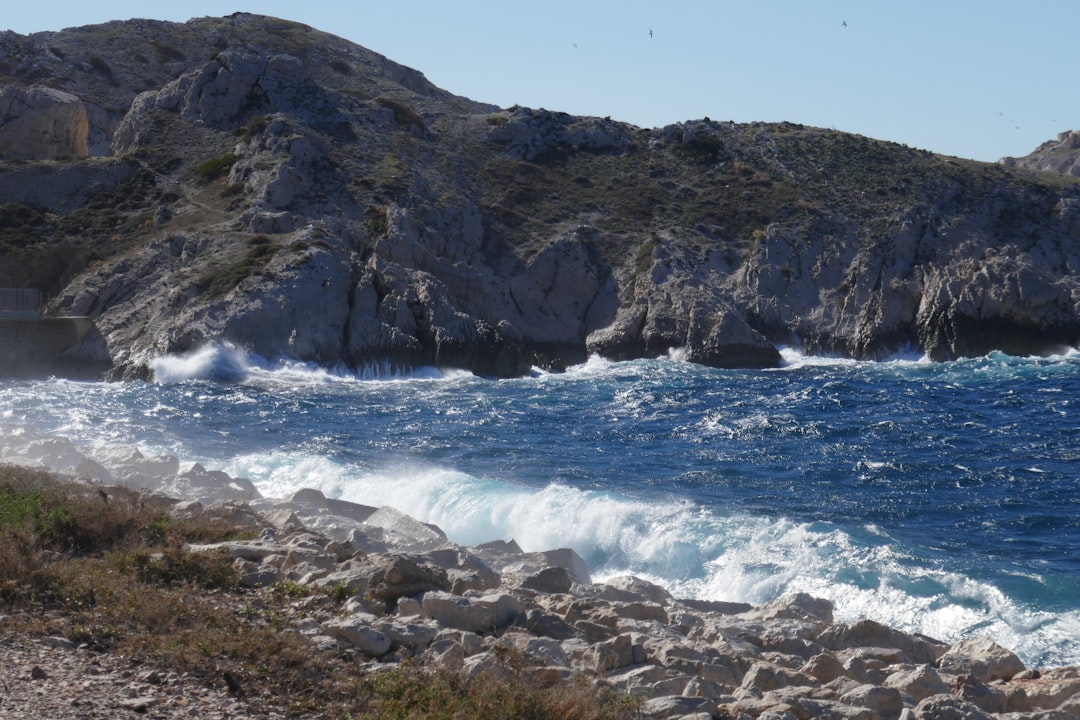 A rocky beach next to a body of water,