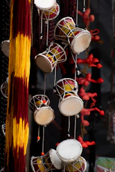 A group of musical instruments hanging from strings