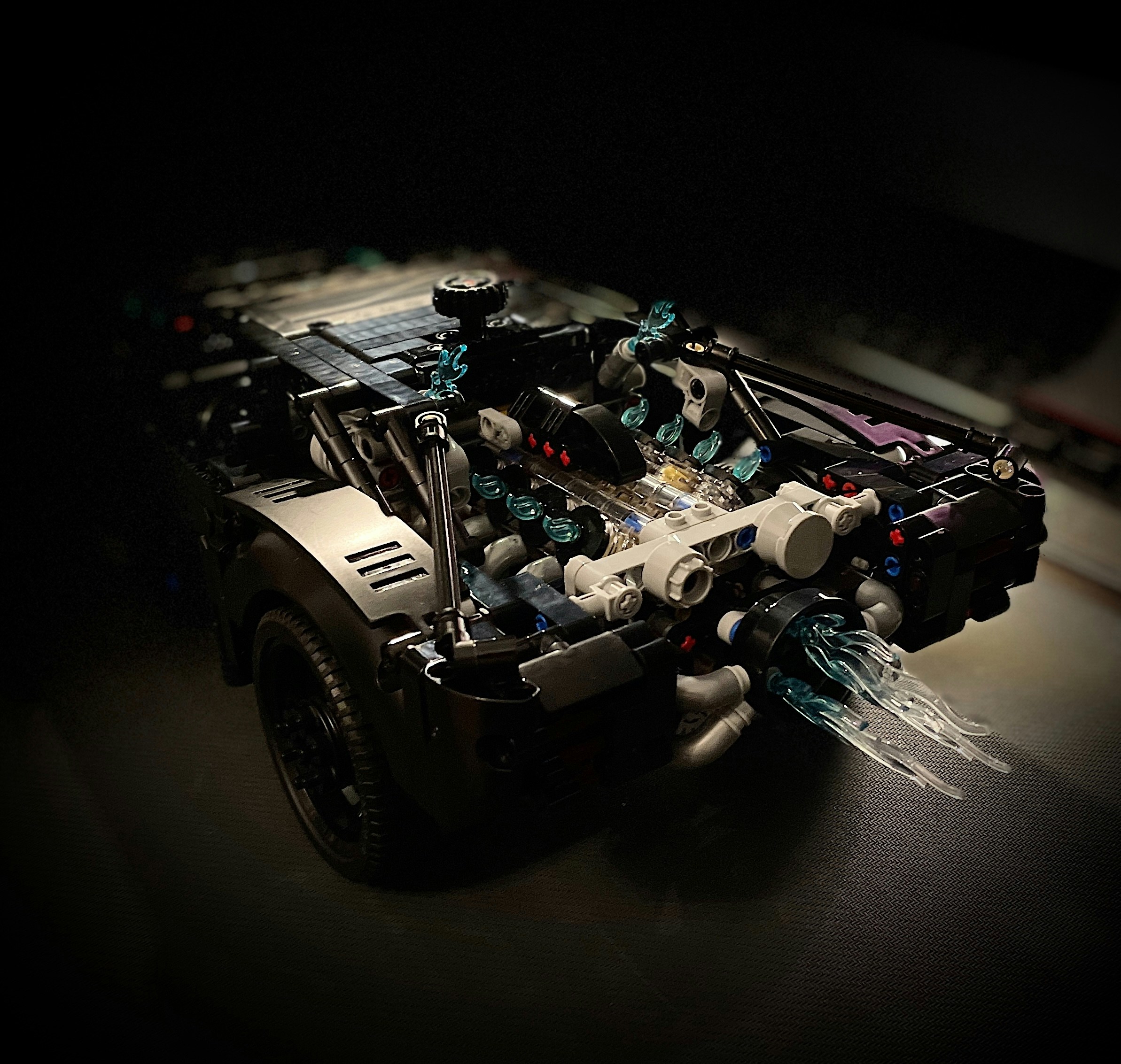 A car made out of legos in the dark
