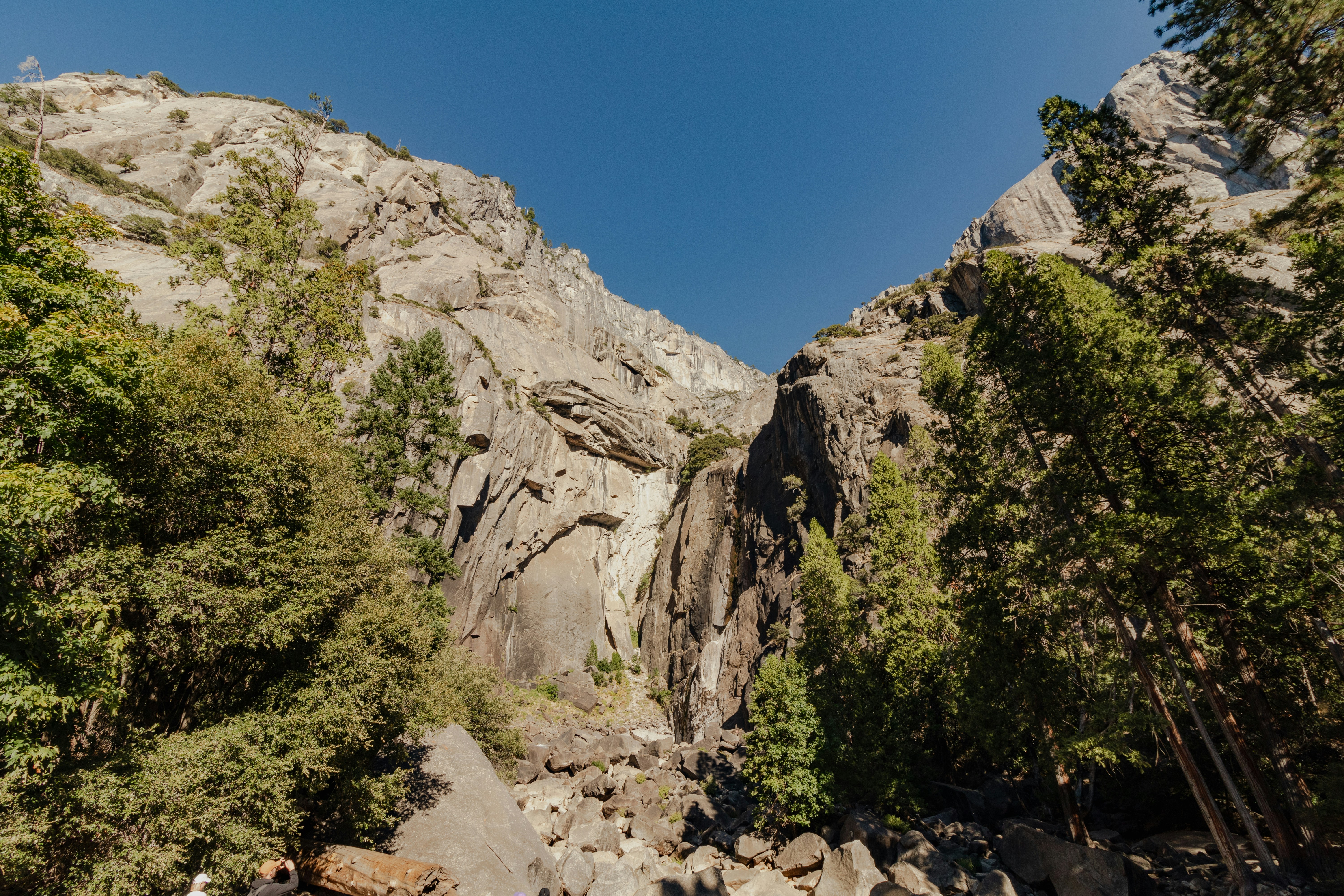 A group of people standing on top of a mountain