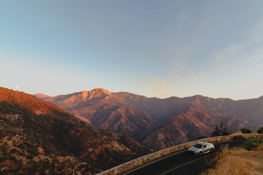Car travelling through a scenic mountain road