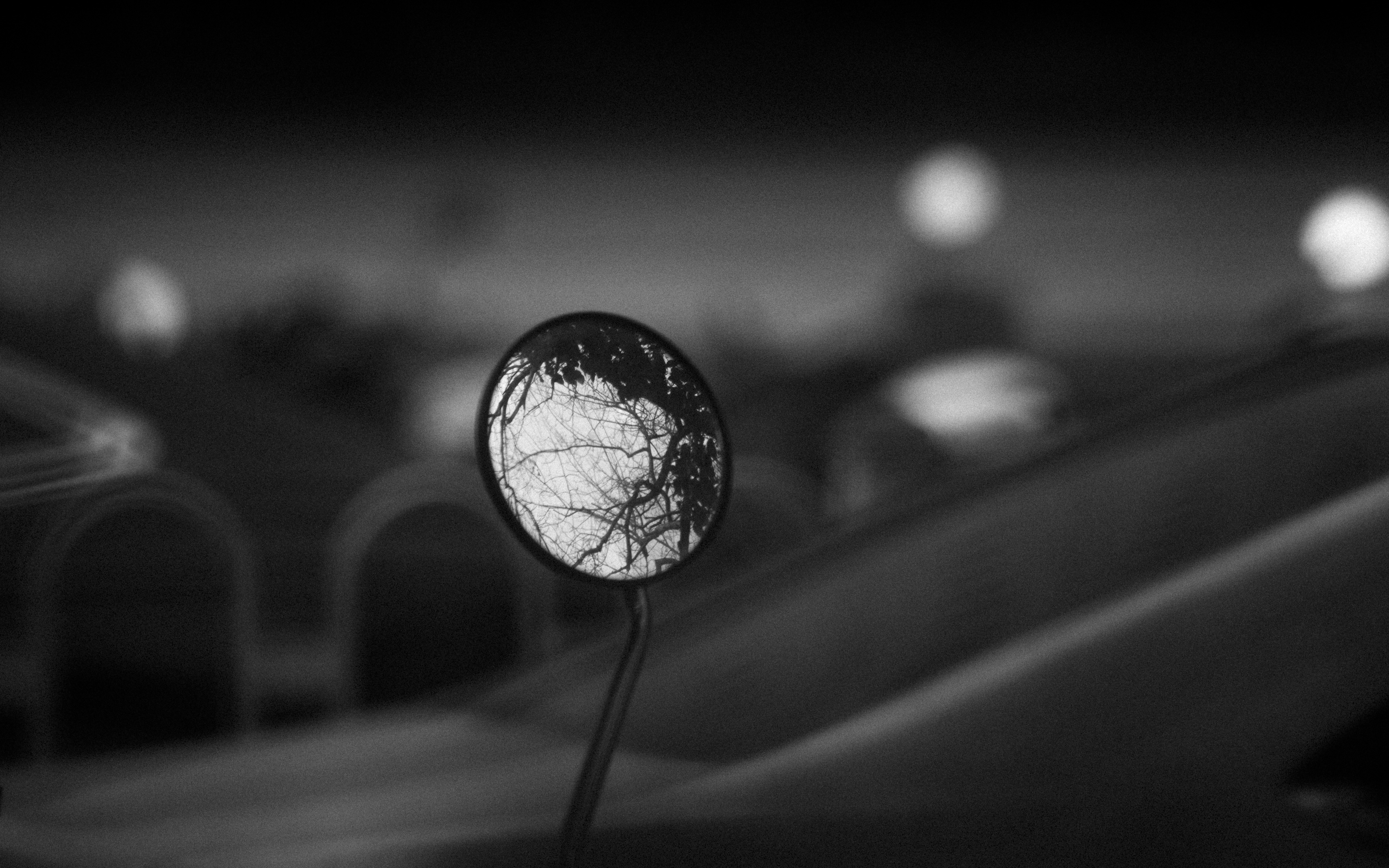 A black and white photo of a street light