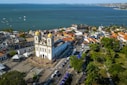 An aerial view of a city with a large body of water