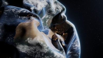 A man in a hoodie with the earth in the background