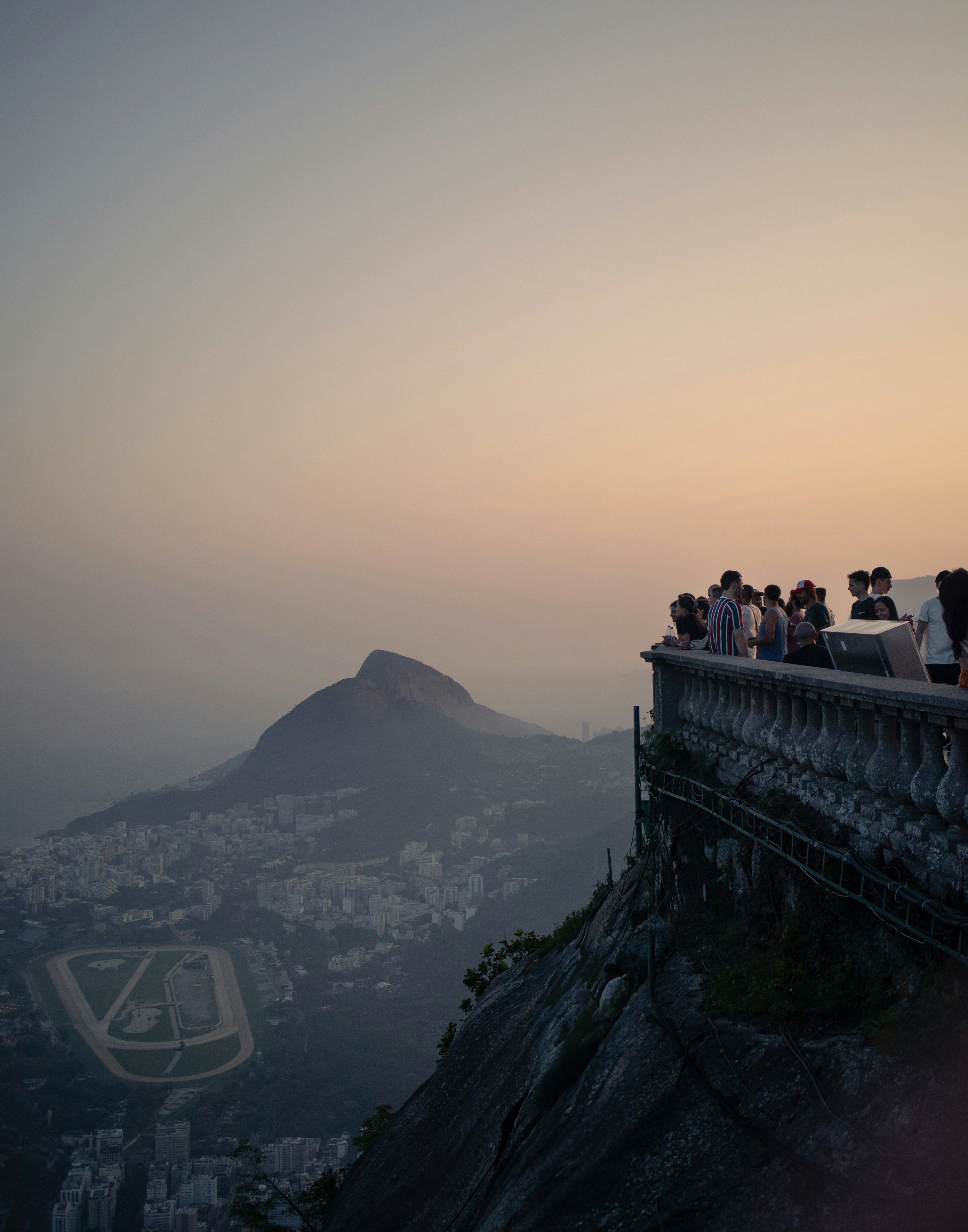 A group of people standing on top of a cliff