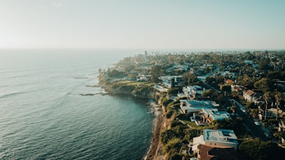 A bird's eye view of a city next to the ocean