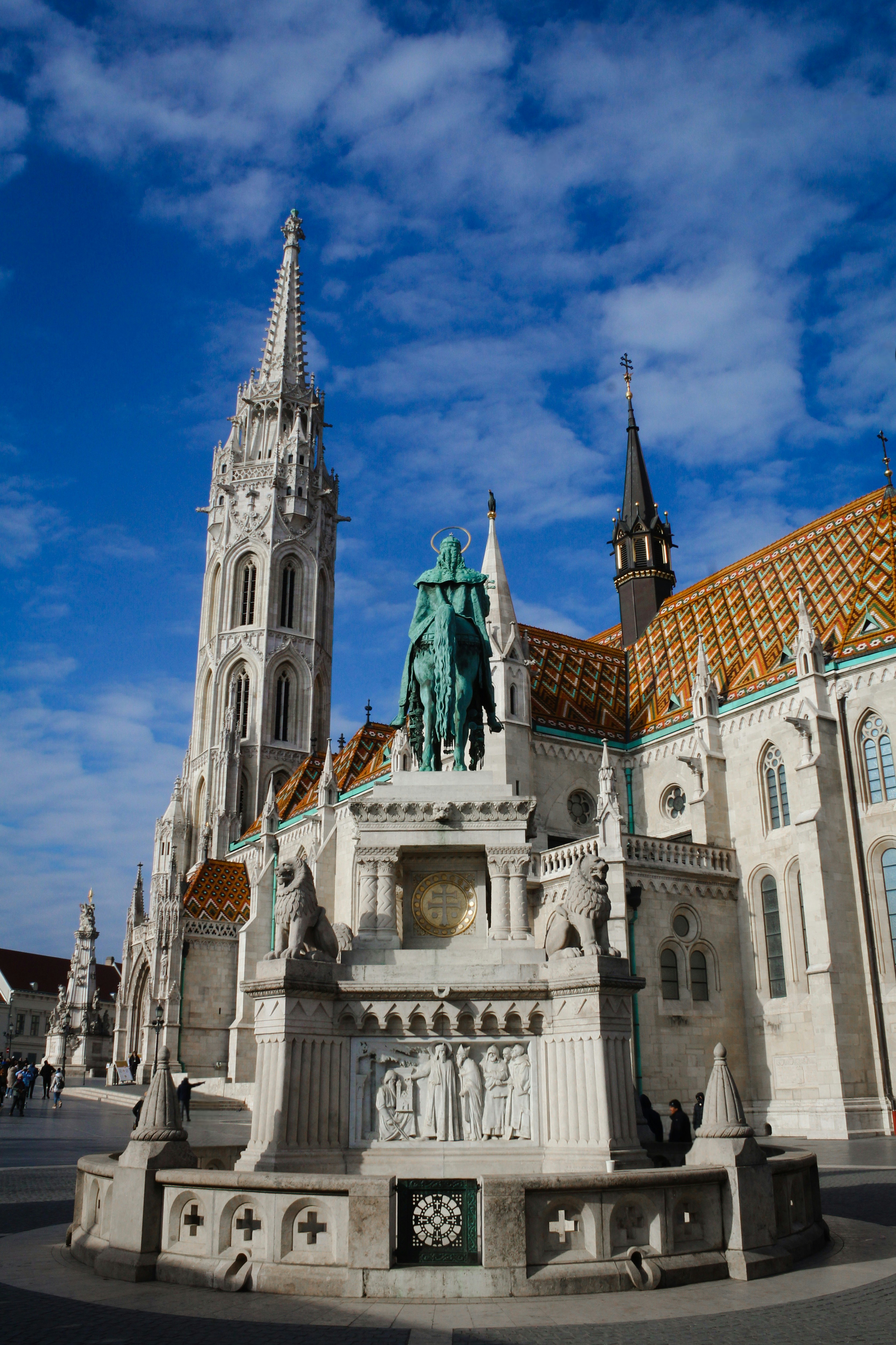 A large building with a statue in front of it