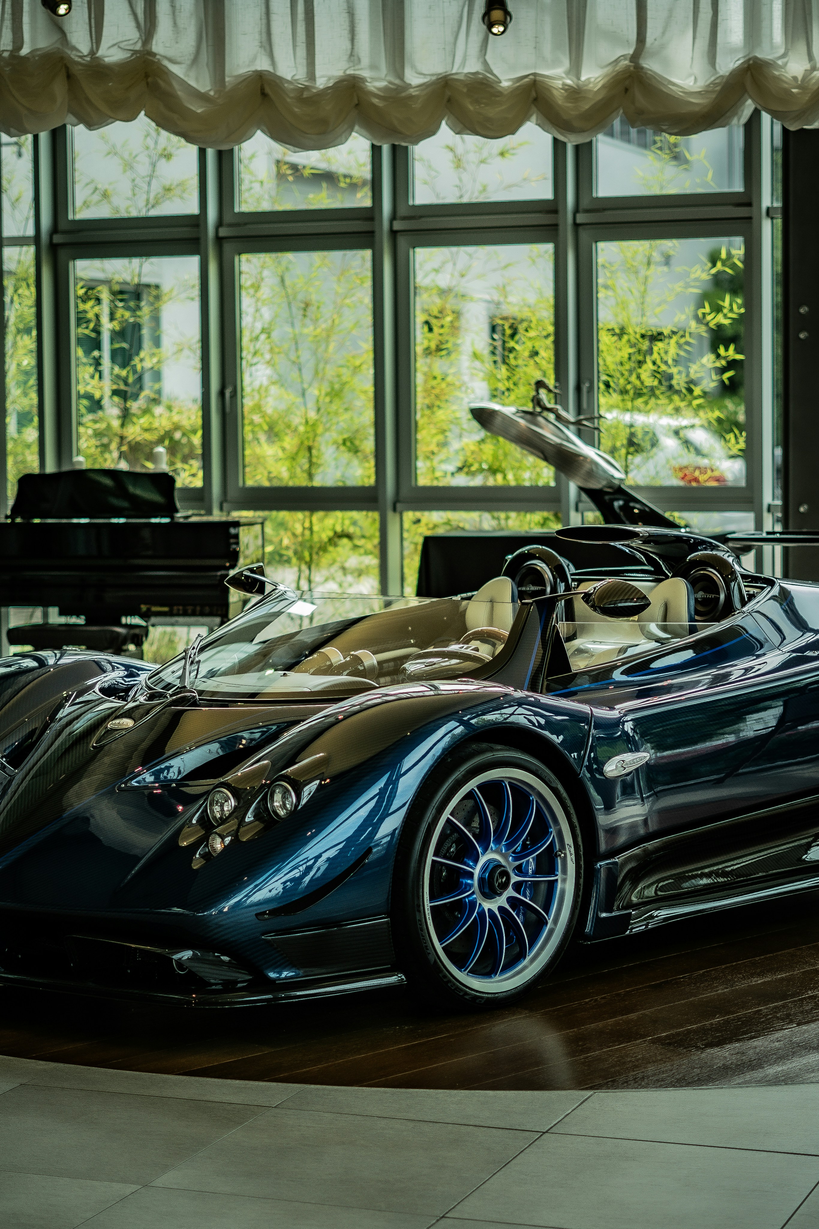 A very nice looking car in a big room