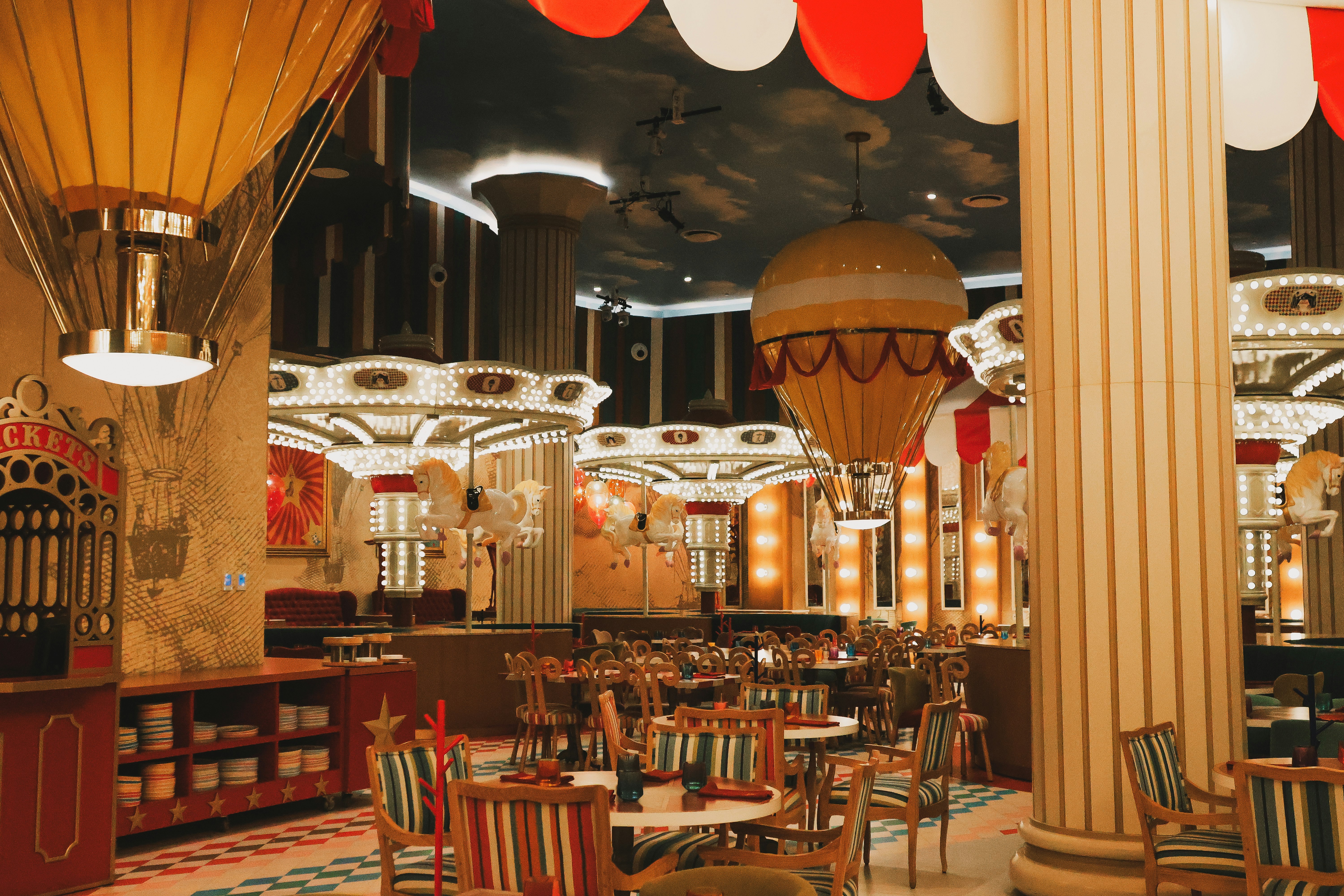 A restaurant with tables, chairs, and hot air balloons, Restaurant interior