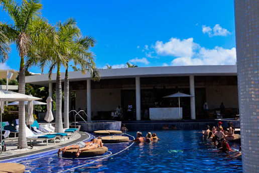 A group of people lounging in a swimming pool