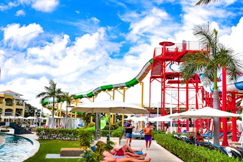 A water park with a water slide in the background