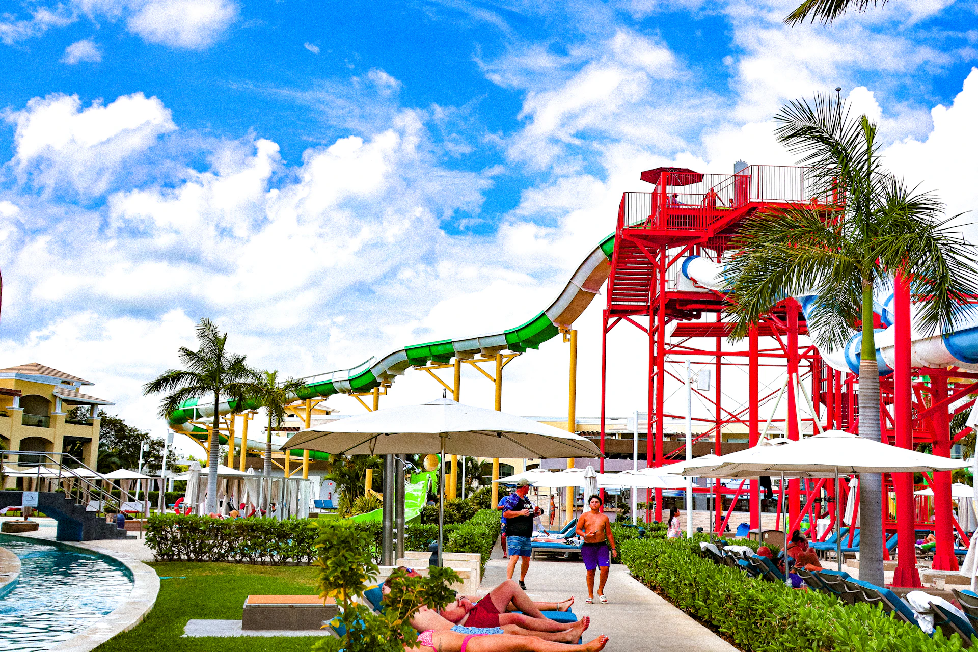 A water park with a water slide in the background