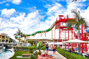 A water park with a water slide in the background