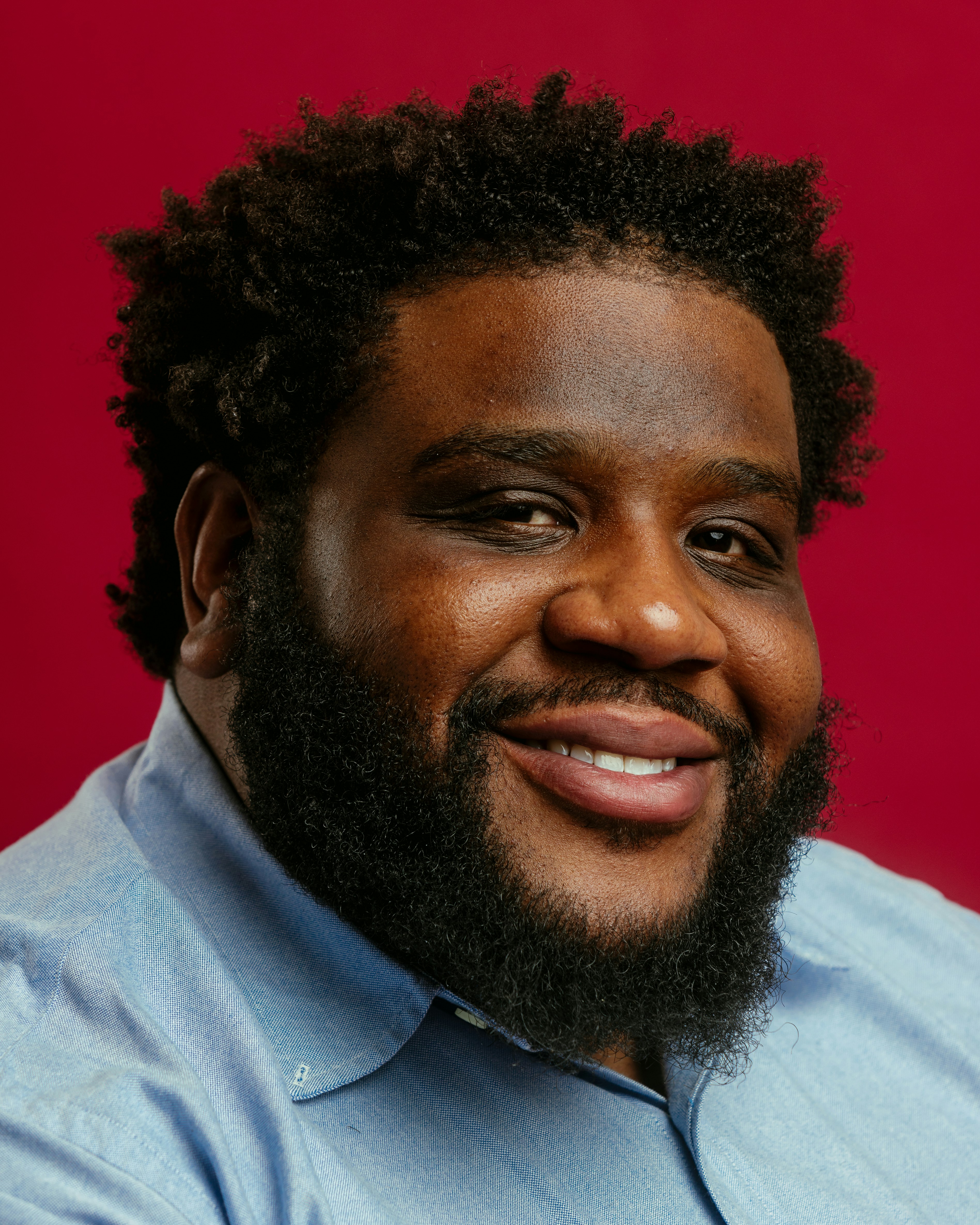 A close up of a person wearing a shirt and tie