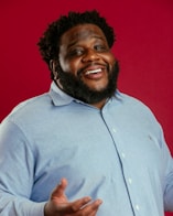 A man with a beard and a blue shirt