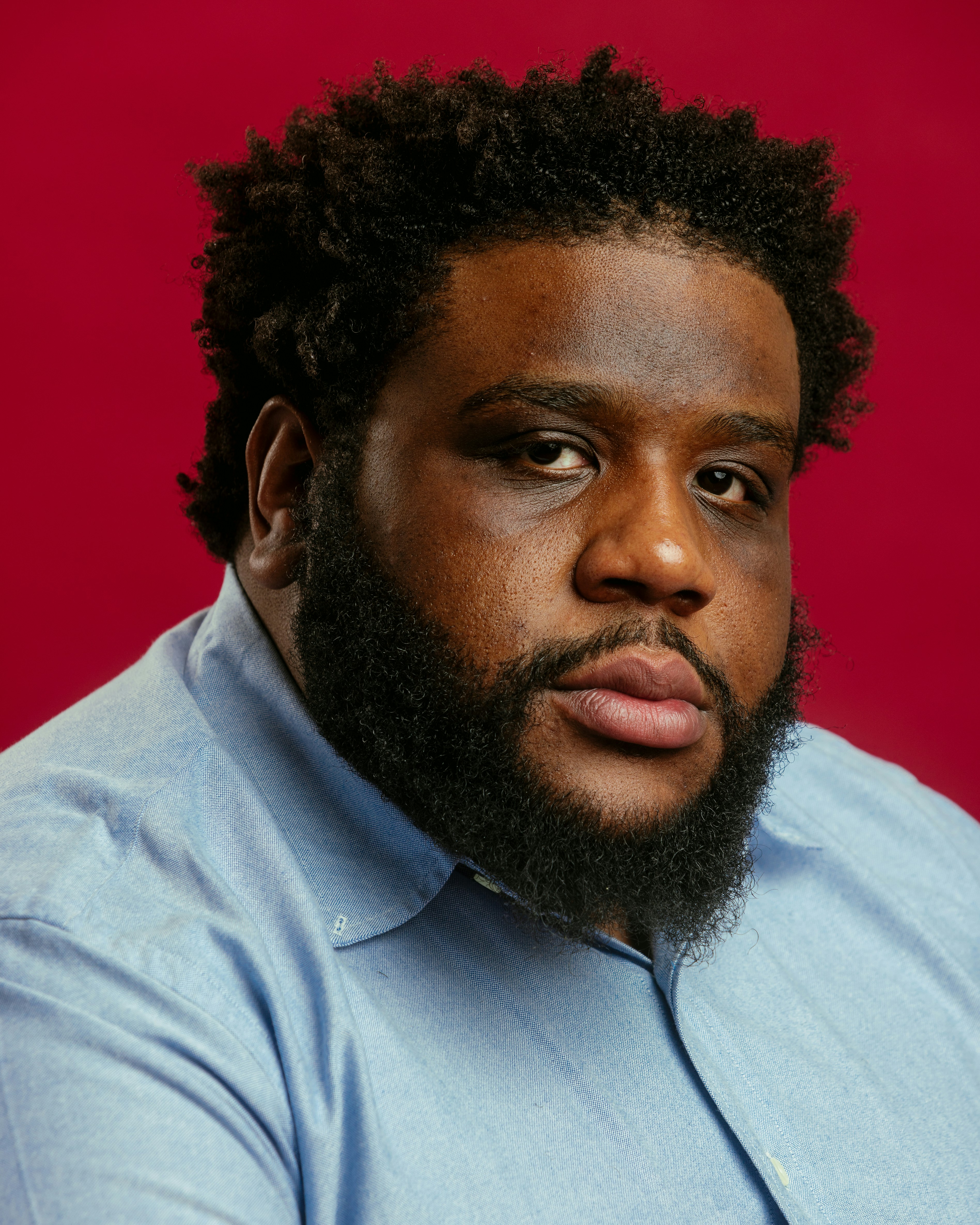 A close up of a person wearing a shirt and tie