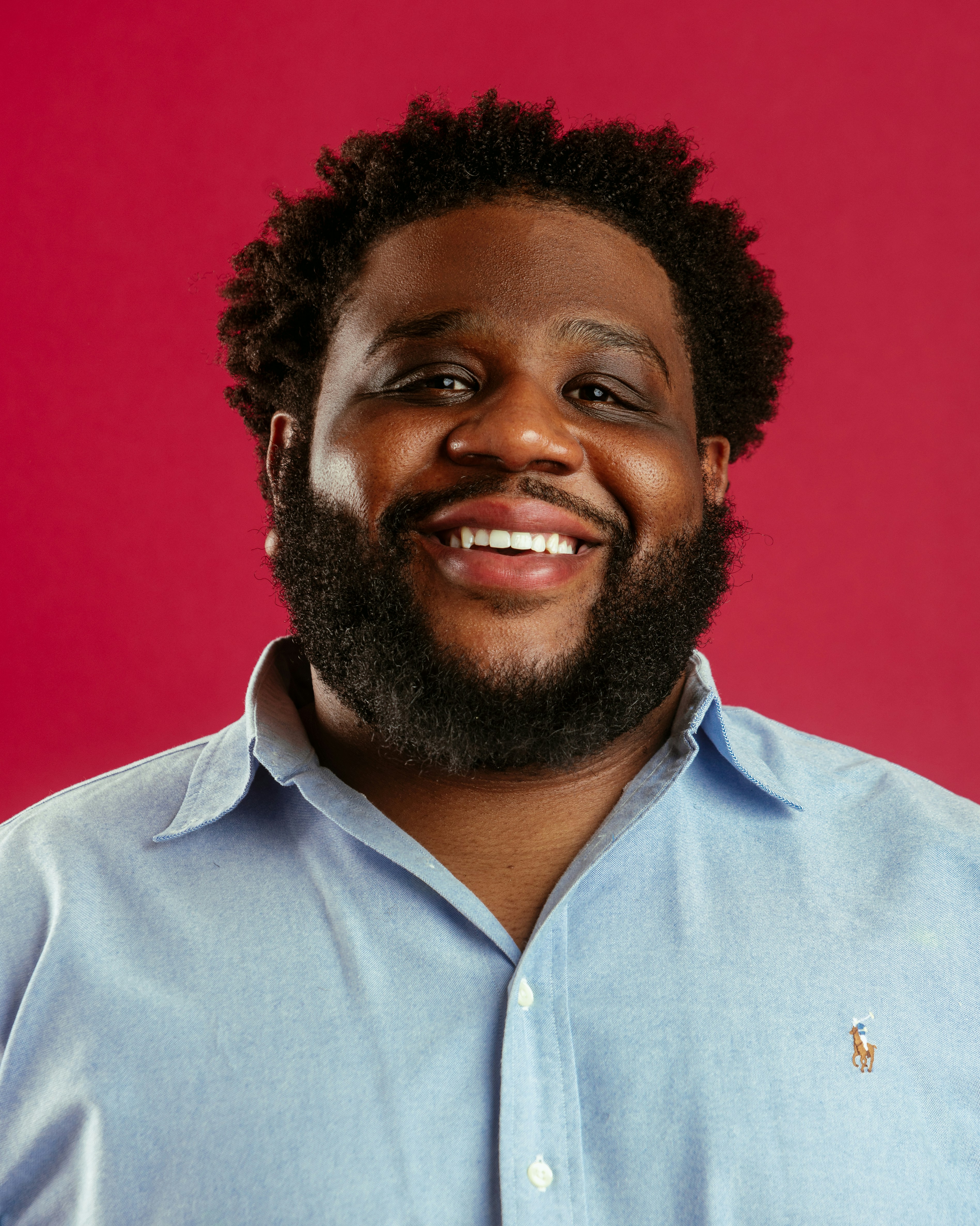A man with a beard and a blue shirt