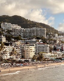 A beach that has a bunch of people on it