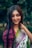 A woman with long hair wearing a colorful sari