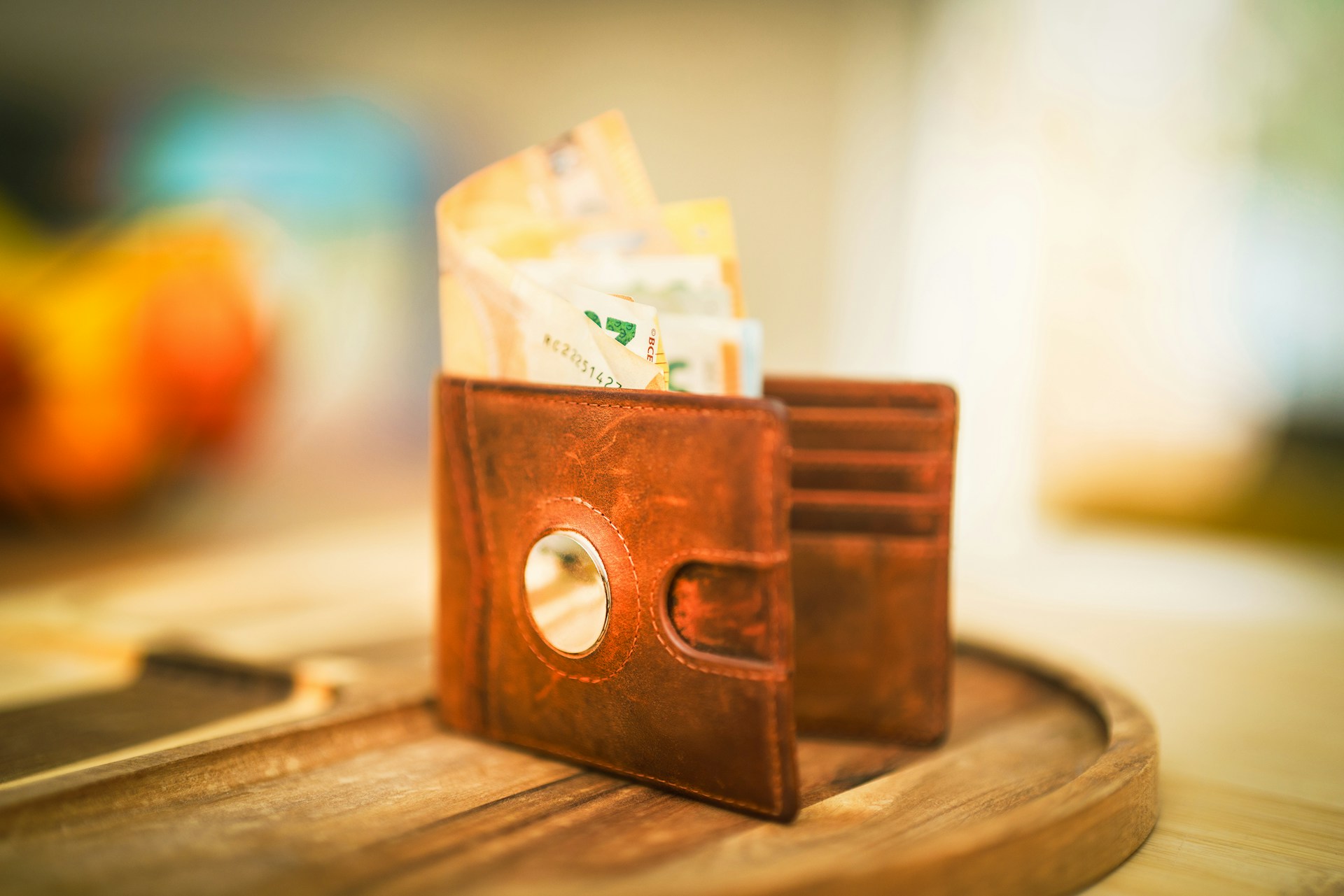 A wallet with money sticking out of it