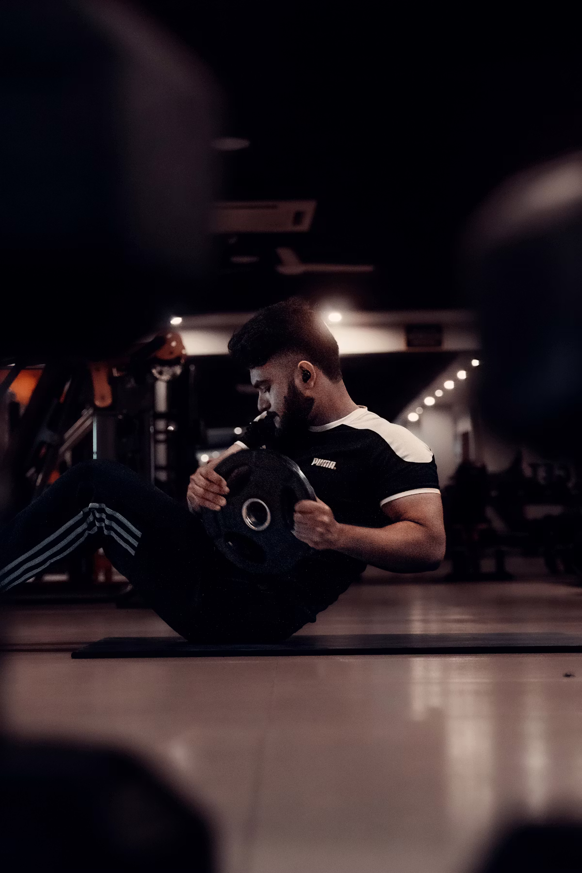 Athlete resting in gym during intense personal training session