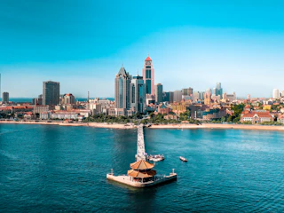 An aerial view of a city and a body of water