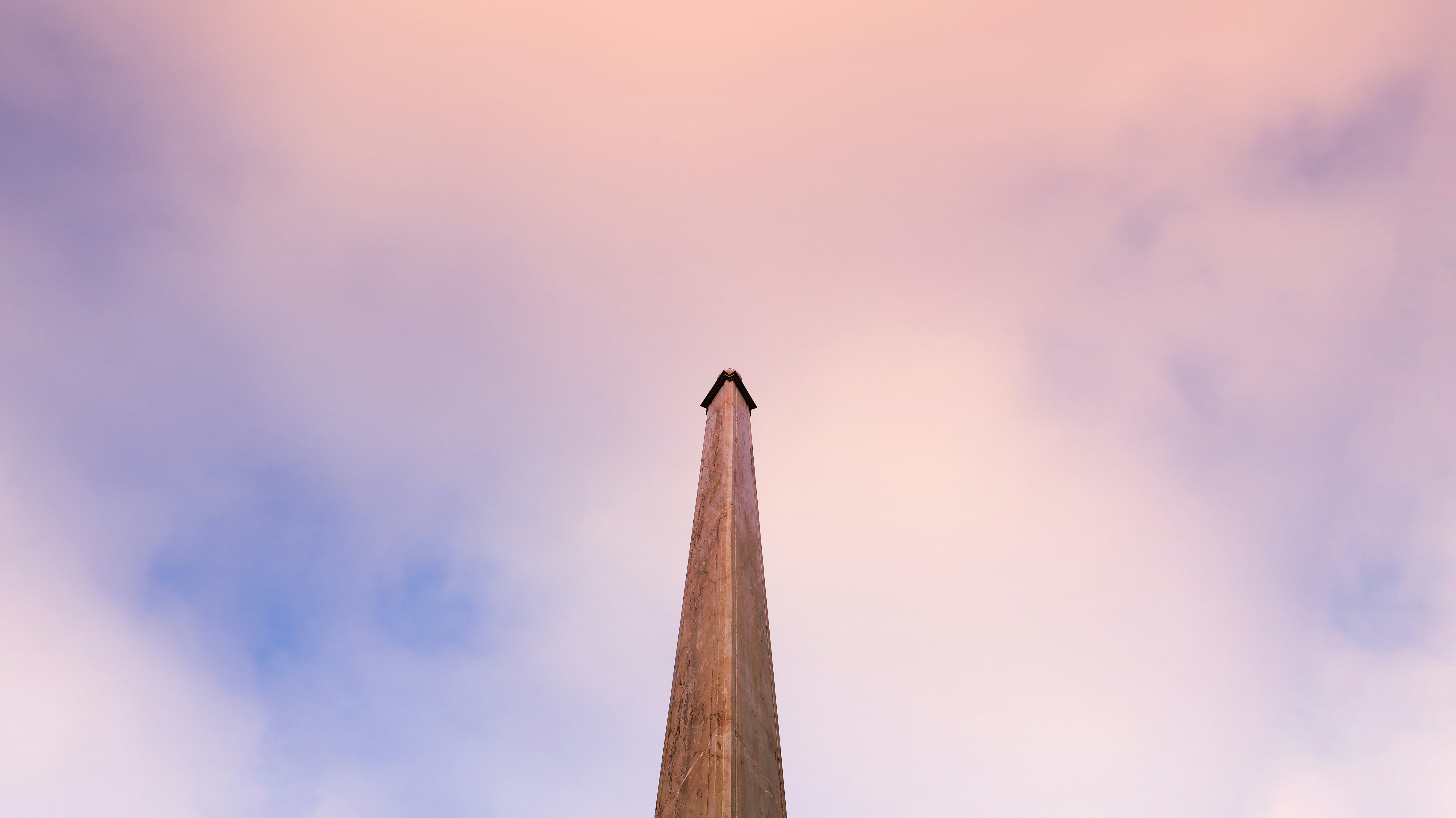 A tall building with a clock on the top of it