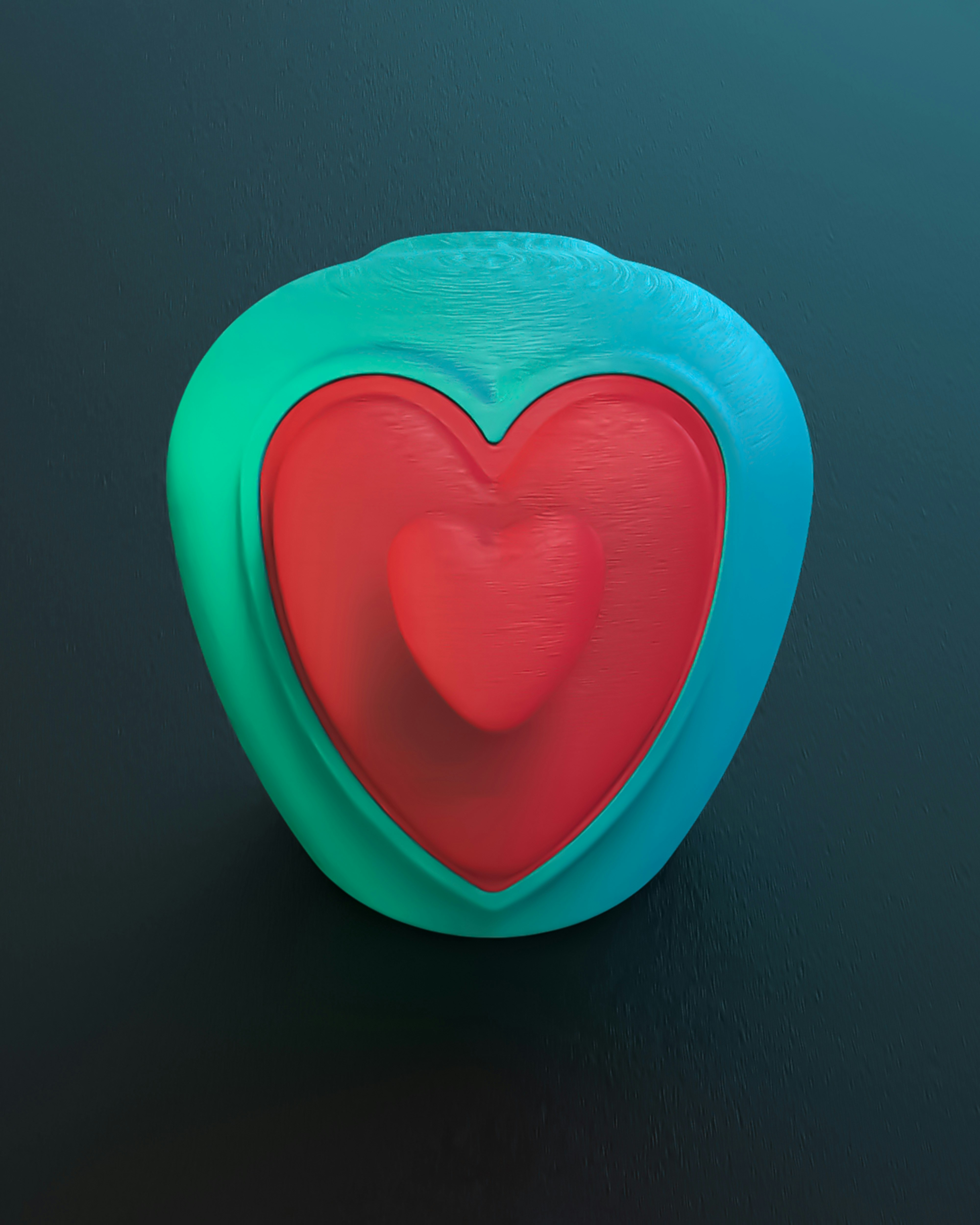 A heart shaped object on a black surface