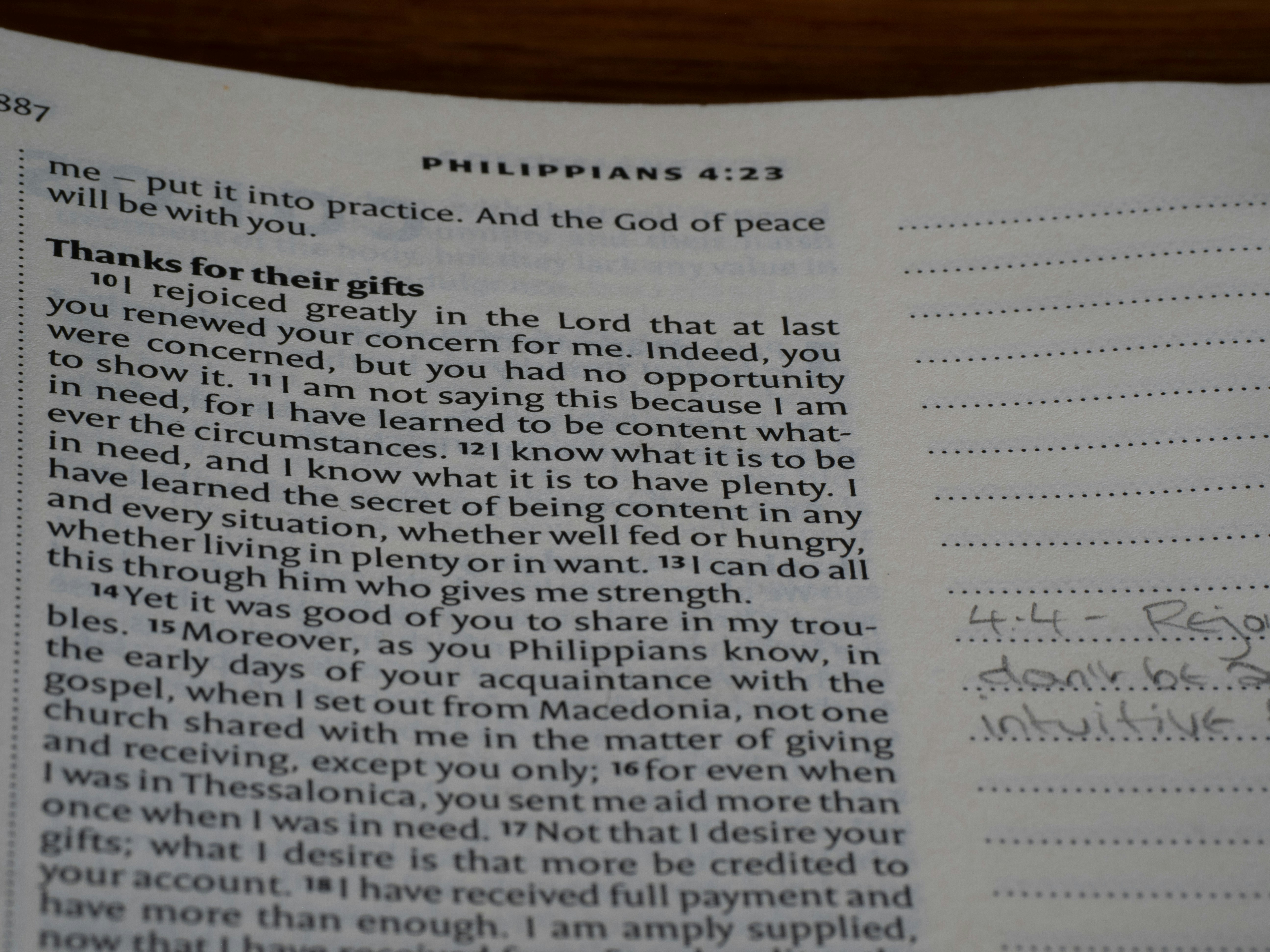 An open book with writing on it sitting on a table