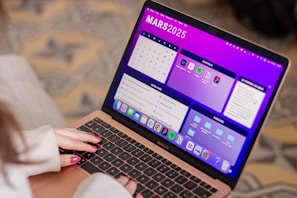 A woman using a laptop computer on her lap