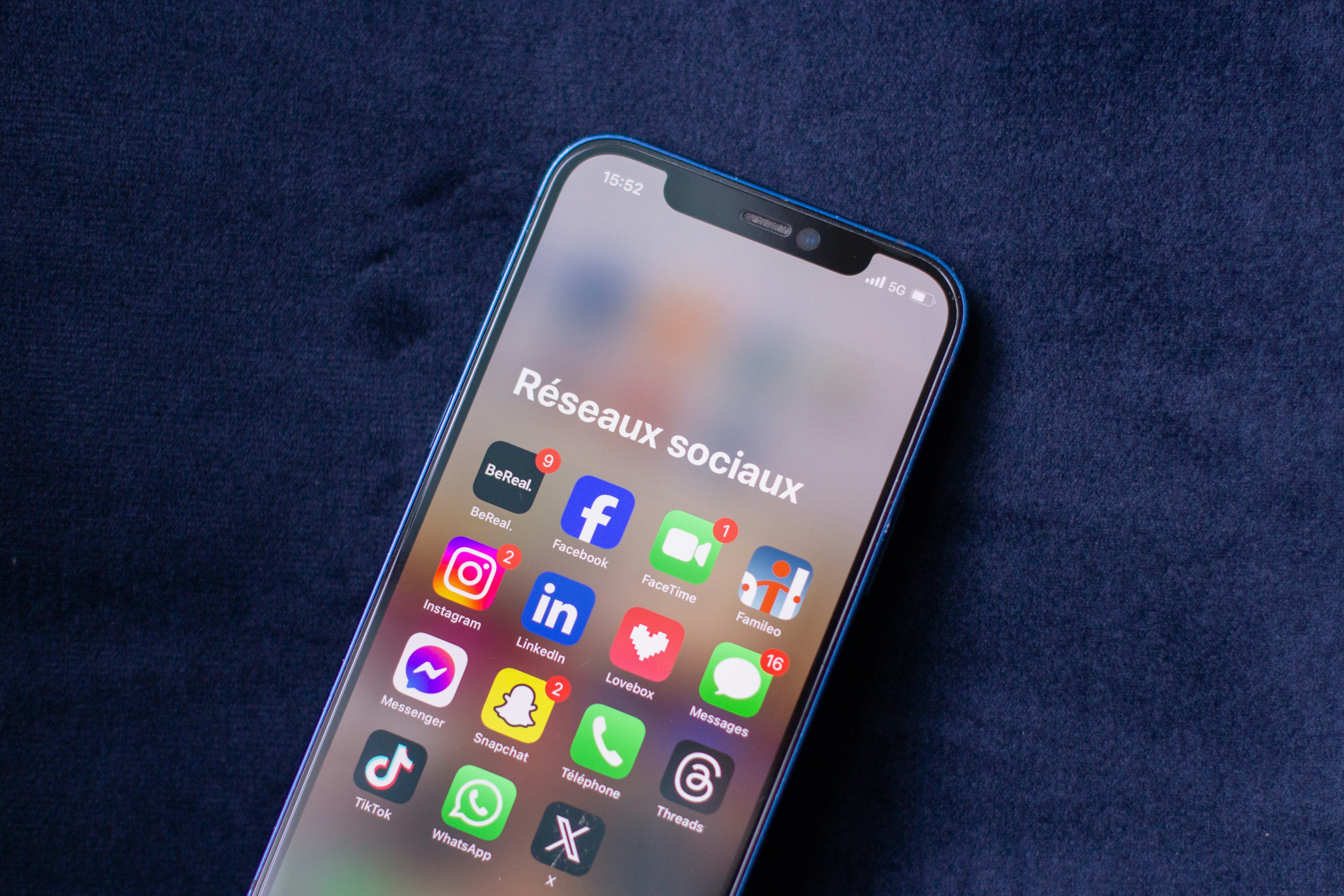 Senior using smartphone in office
