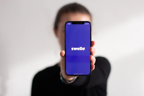 A woman holding a cell phone up to the camera