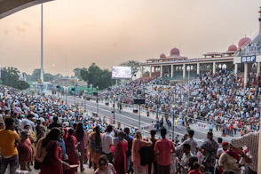 A large crowd of people standing in a stadium